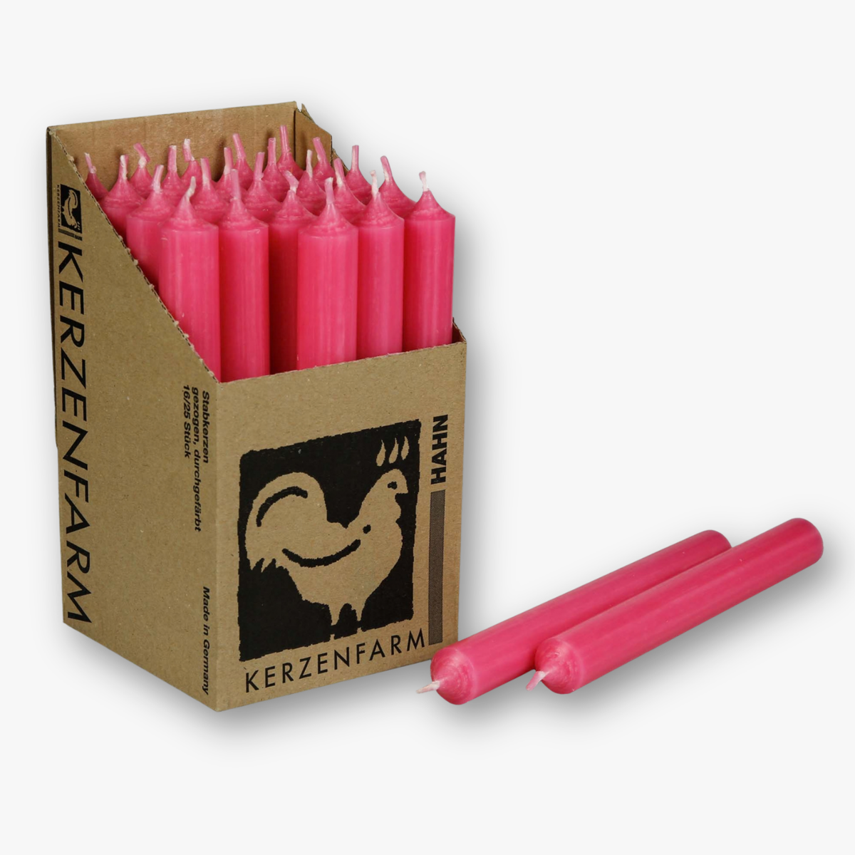 Aufsteller mit Echtwachs-Stabkerzen in Pink, davor zwei liegende Kerzen
